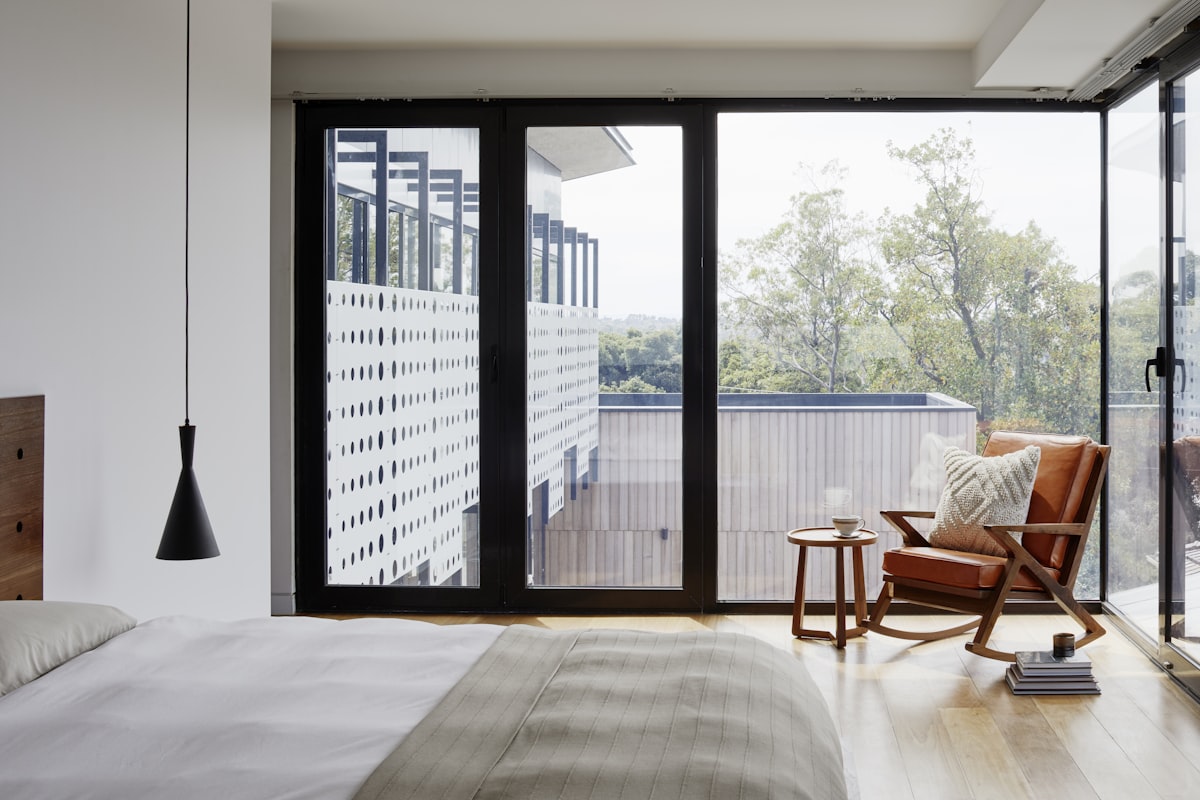 Asian family playing in modern living room with bamboo flooring
